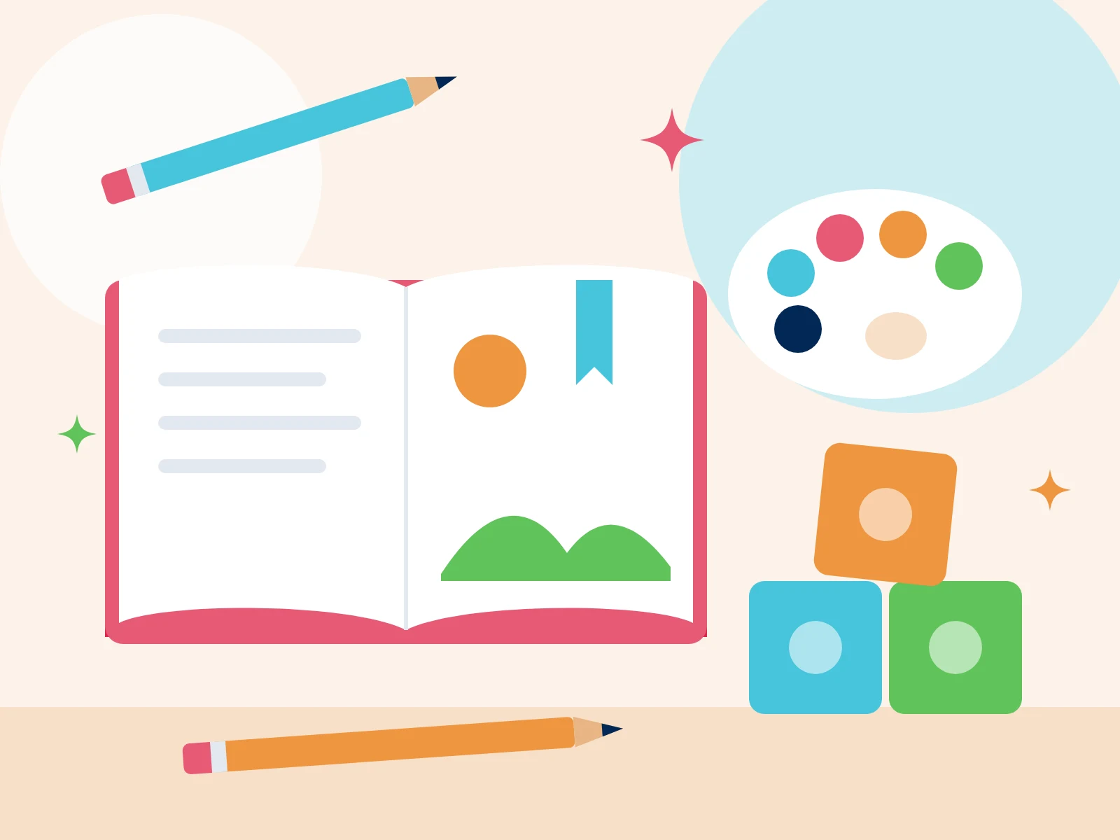An open storybook with pencils, a paint palette and building blocks
